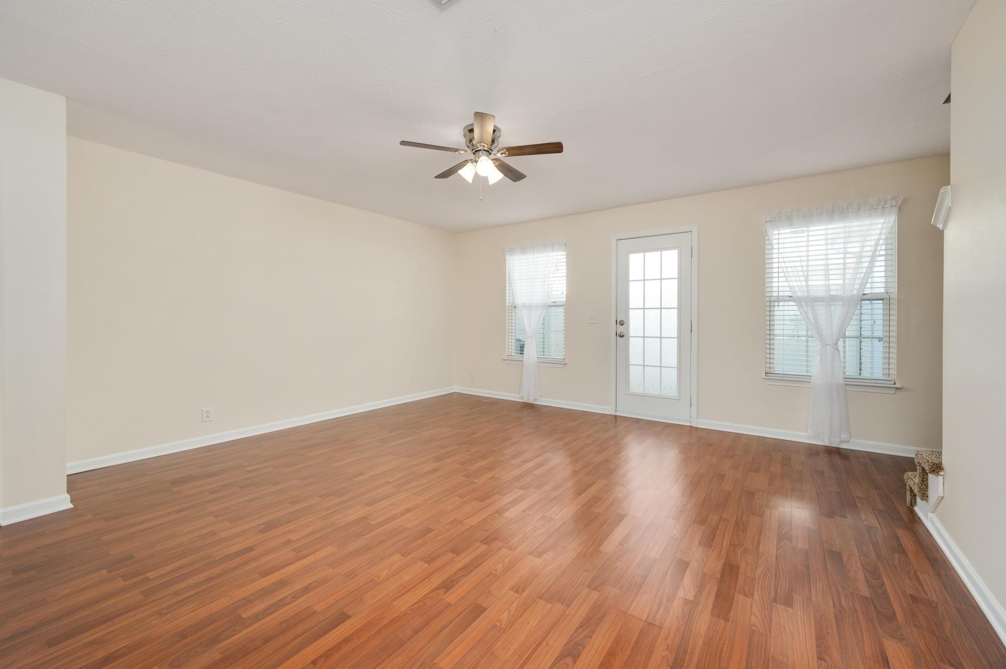 3016 London View Murfreesboro, TN 37128 - Photo 7 of 19 an empty room with wooden floor fan and windows
