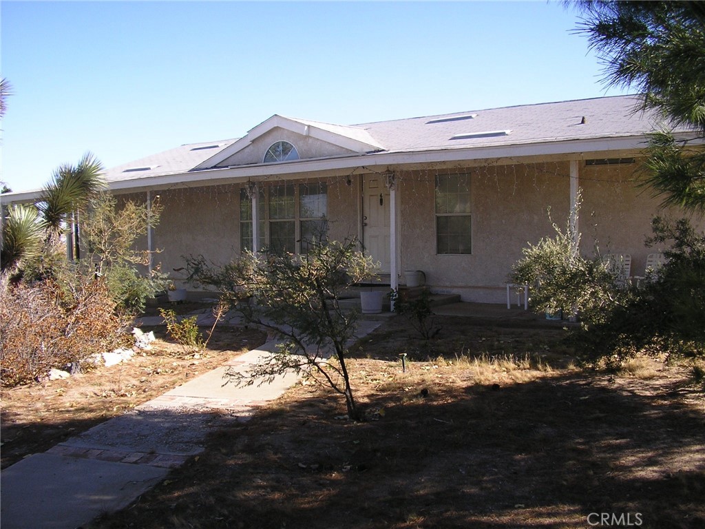 a front view of a house with yard