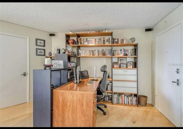 a view of a workspace with furniture