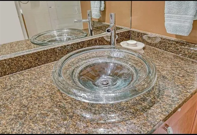 a spacious bedroom with a bed and large windows