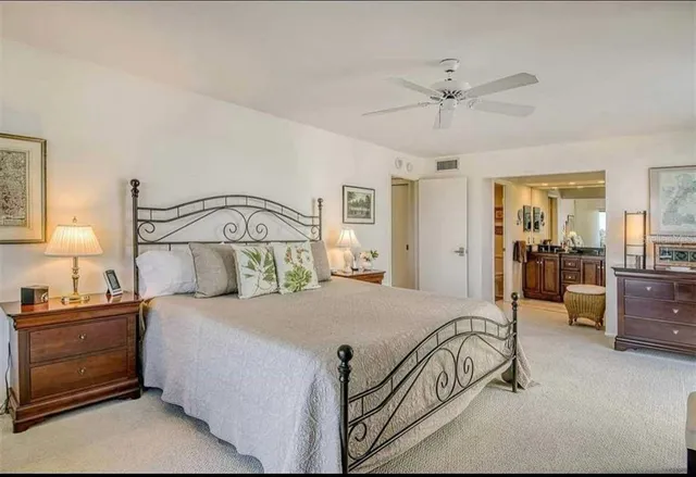 a bathroom with a granite countertop sink a mirror and a shower