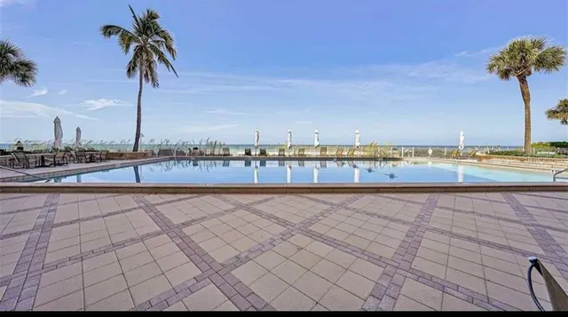 a view of a building with outdoor seating