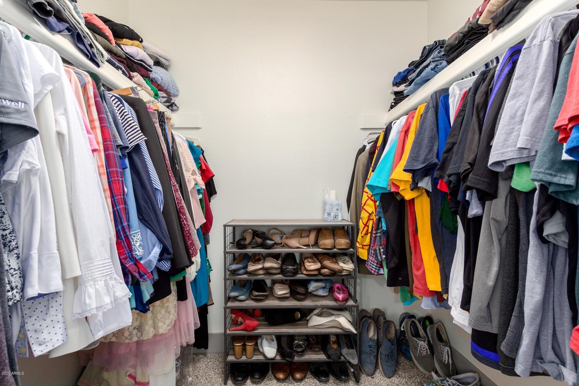 2439 East Riviera Drive Tempe, AZ 85282 - Photo 22 of 40 a view of walk in closet with clothes and shoes