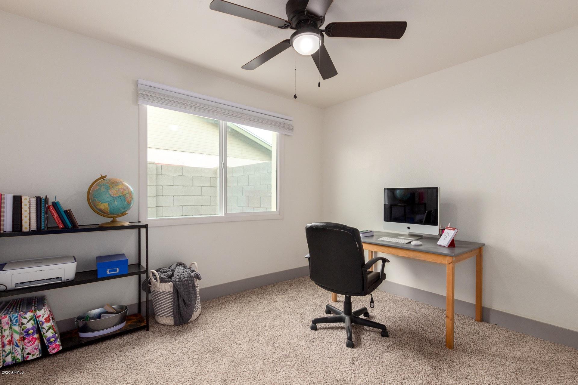 2439 East Riviera Drive Tempe, AZ 85282 - Photo 25 of 40 a view of a workspace with furniture and a window