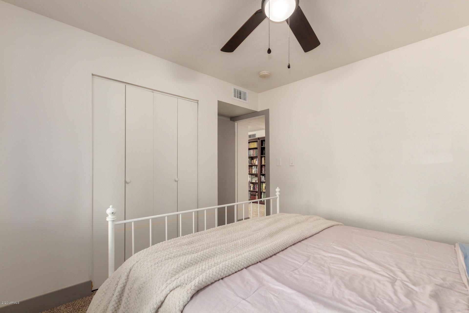 2439 East Riviera Drive Tempe, AZ 85282 - Photo 30 of 40 a bedroom with a bed and a window