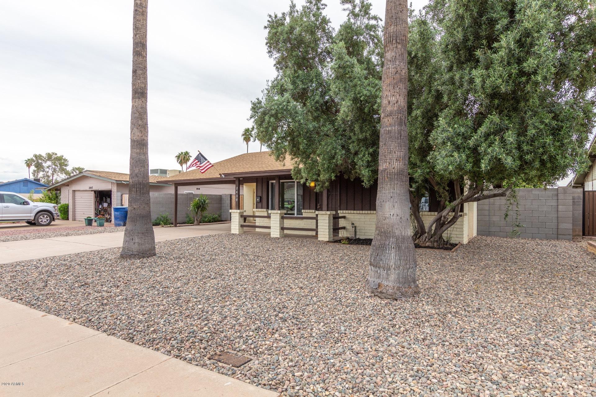 2439 East Riviera Drive Tempe, AZ 85282 - Photo 3 of 40 a view of a house with a yard