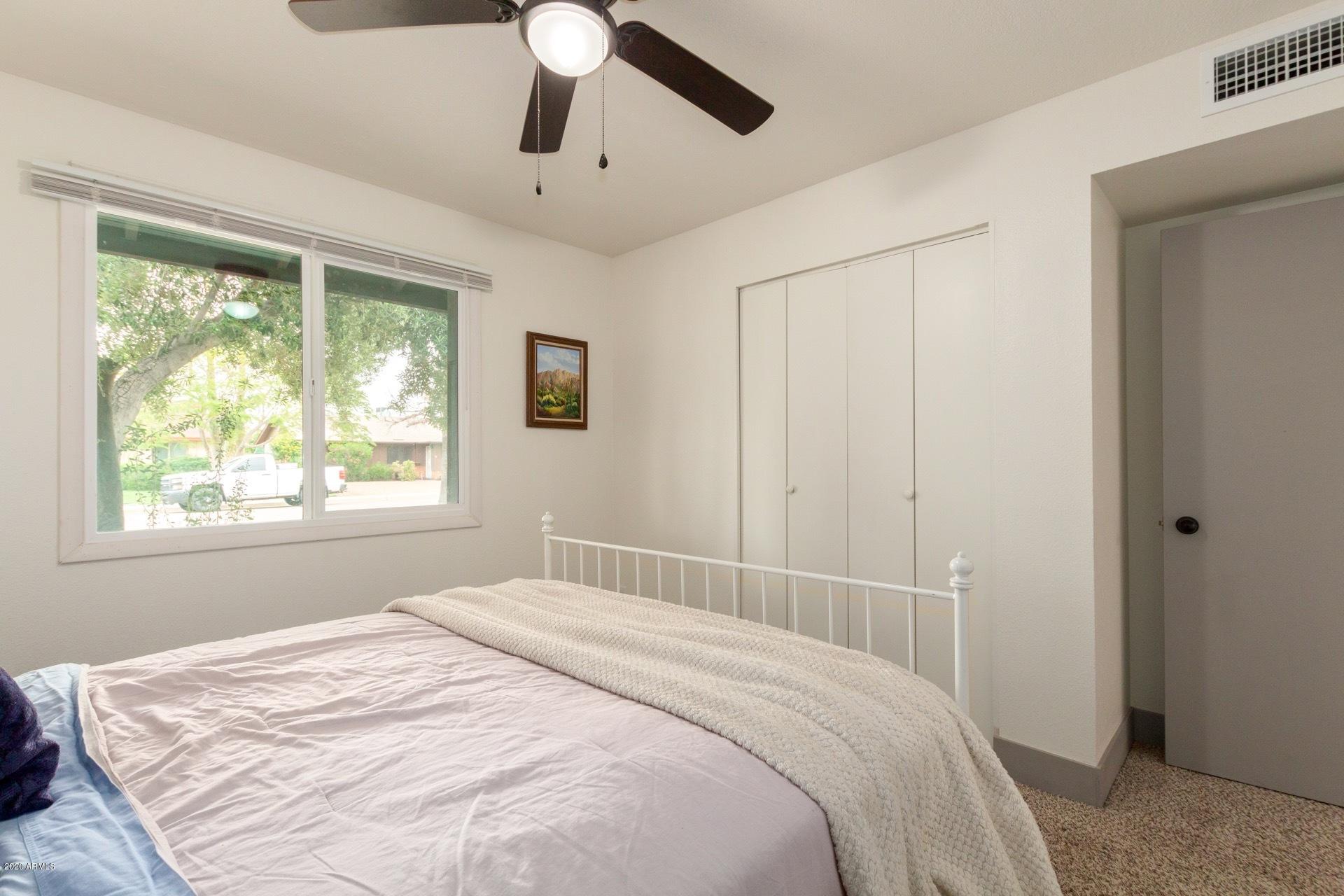 2439 East Riviera Drive Tempe, AZ 85282 - Photo 31 of 40 a bedroom with a large bed and a window