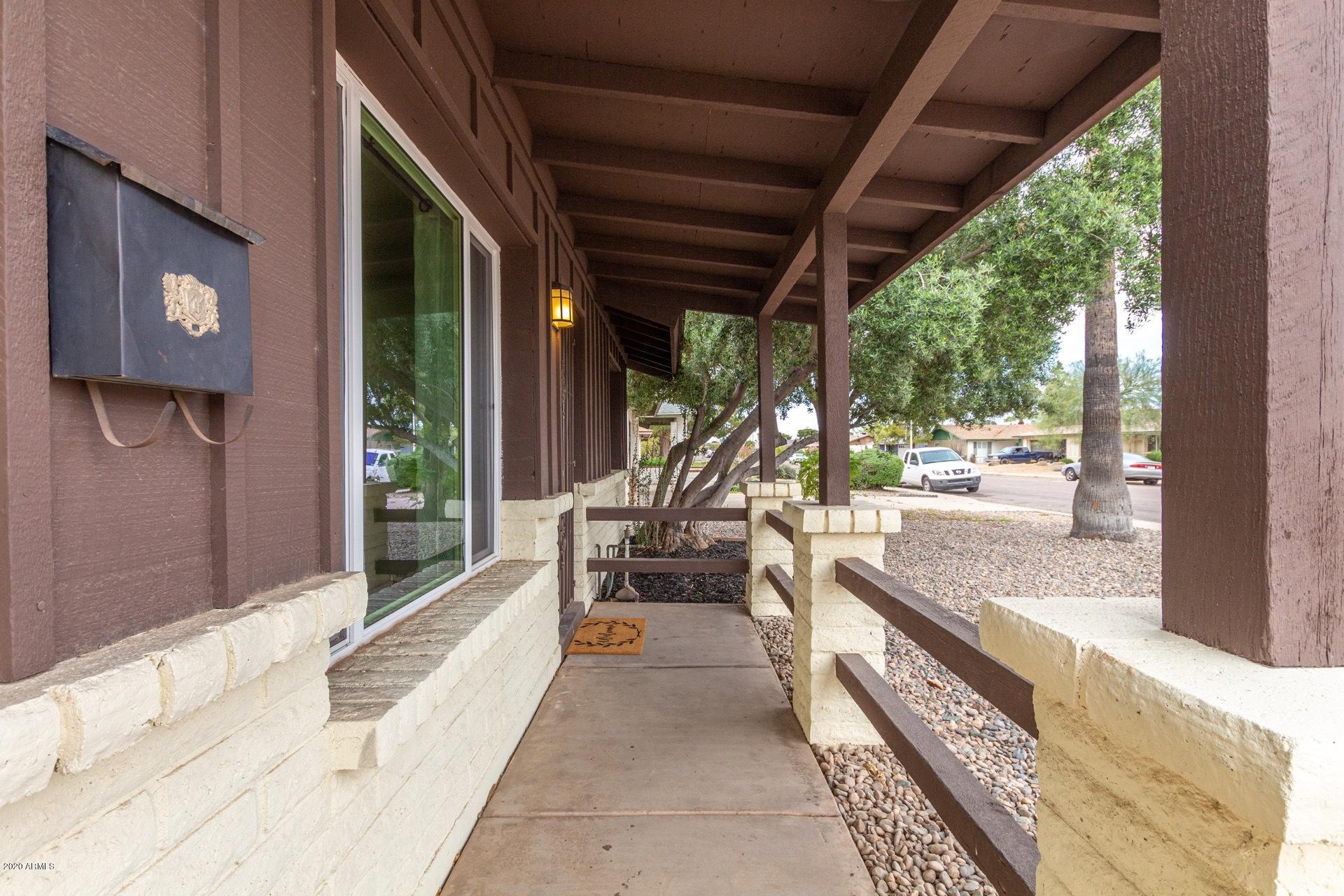 2439 East Riviera Drive Tempe, AZ 85282 - Photo 5 of 40 a living room with large windows