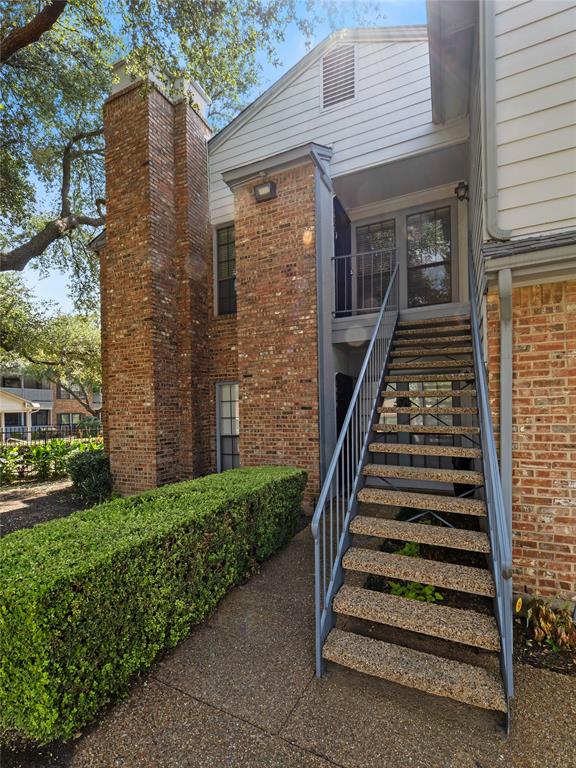 3101 Townbluff Drive, Unit 1024 Plano, TX 75075 - Photo 4 of 19 a front view of a house with stairs