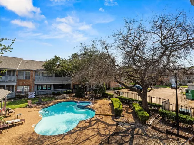 a view of a swimming pool with a patio
