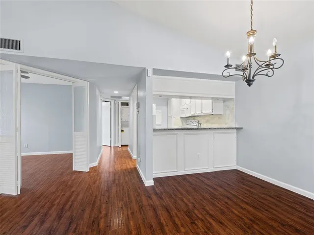 a view of a room with wooden floor and staircase