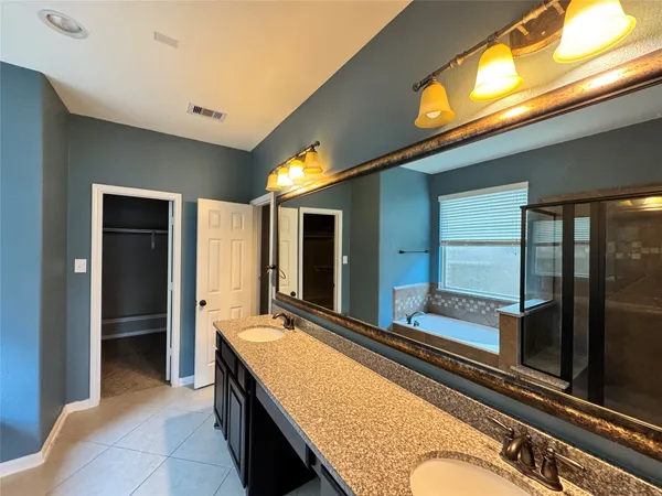 a living room with stainless steel appliances kitchen island granite countertop furniture and a large window