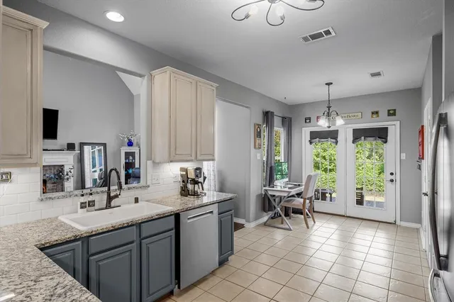 a spacious bathroom with a double vanity sink a mirror and a bathtub