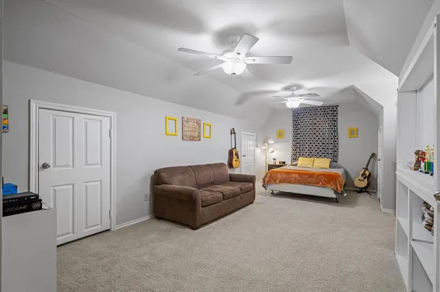 a bedroom with furniture and a chandelier