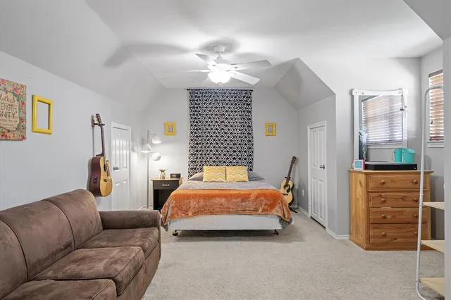 a bedroom with a bed closet and window