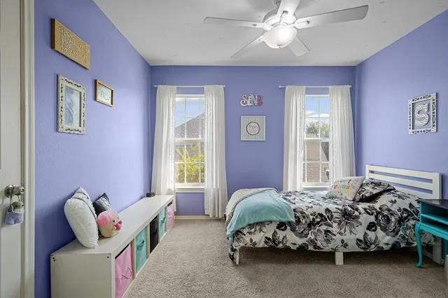 a bedroom with furniture and windows