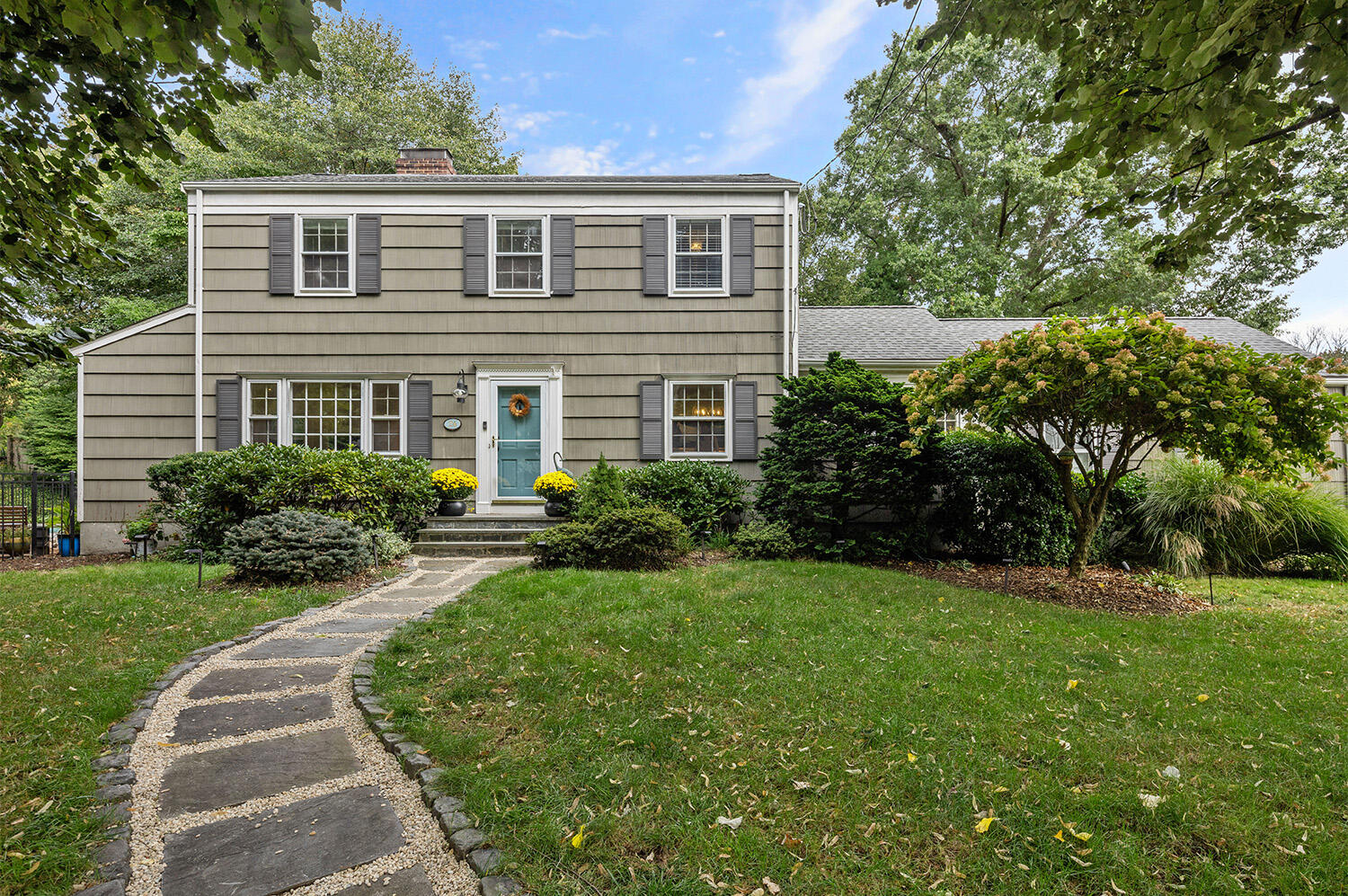 24 Salt Box Lane Darien, CT 06820 - Photo 1 of 32 a front view of a house with a yard
