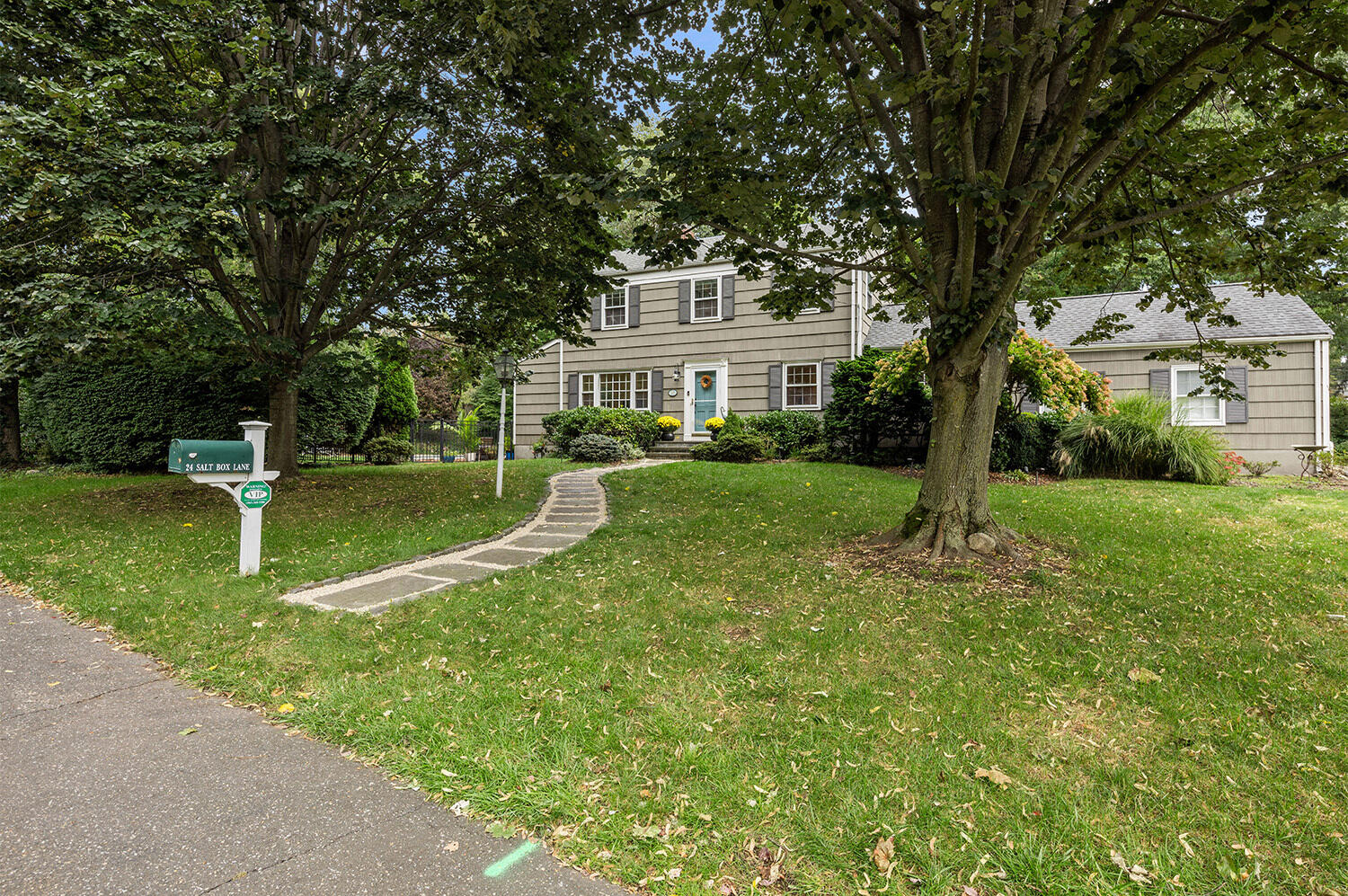 24 Salt Box Lane Darien, CT 06820 - Photo 2 of 32 a view of house in front of a big yard with large trees
