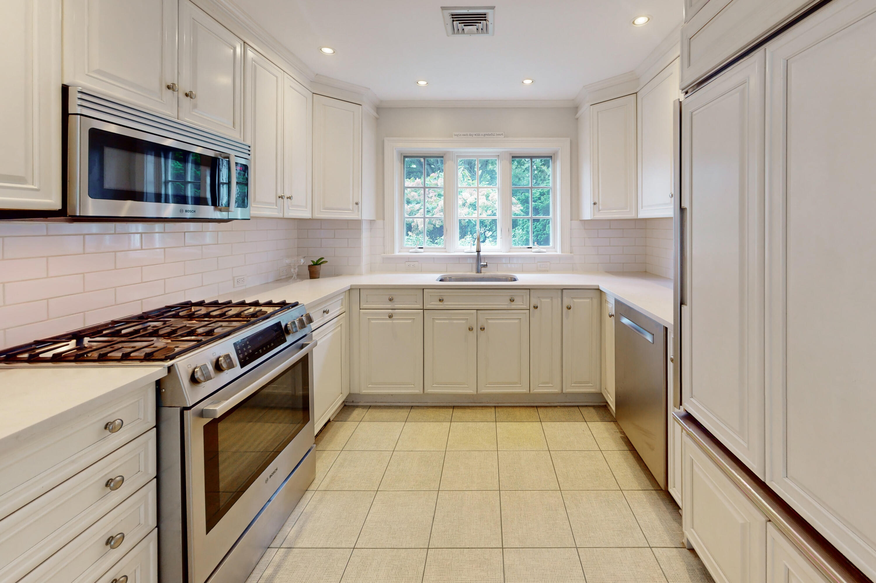 24 Salt Box Lane Darien, CT 06820 - Photo 9 of 32 a kitchen with a stove sink and microwave