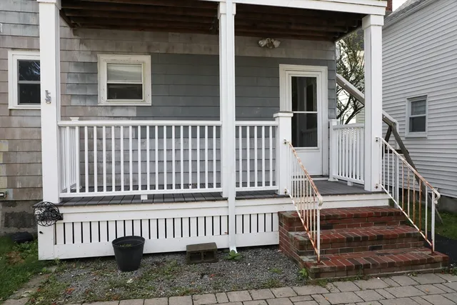 a front view of a house with a small yard