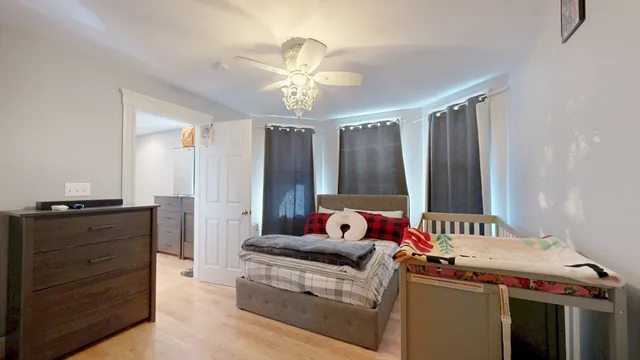 a bedroom with furniture and a window