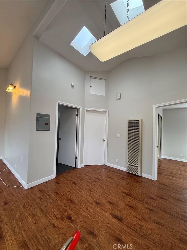 1131 252nd Street, Unit B Harbor City, CA 90710 - Photo 4 of 12 a view of a big room with wooden floor and windows