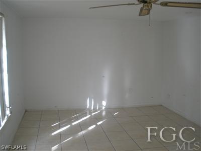 1112 Patterson Road Cape Coral, FL 33909 - Photo 3 of 7 a view of a room with racks on the wall