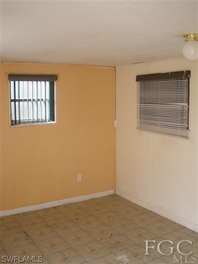 1112 Patterson Road Cape Coral, FL 33909 - Photo 6 of 7 a view of an empty room with a window