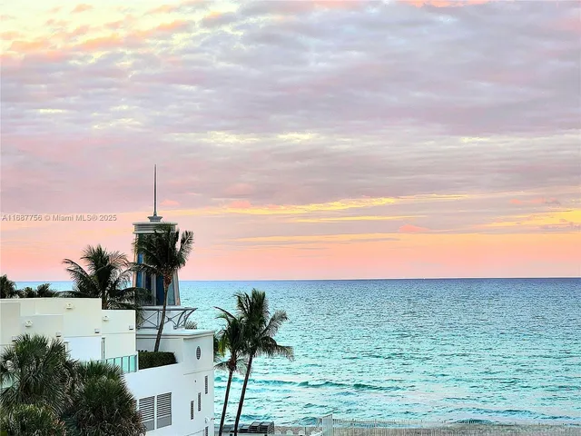 a view of a lake with a yard