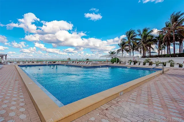a view of swimming pool with a yard