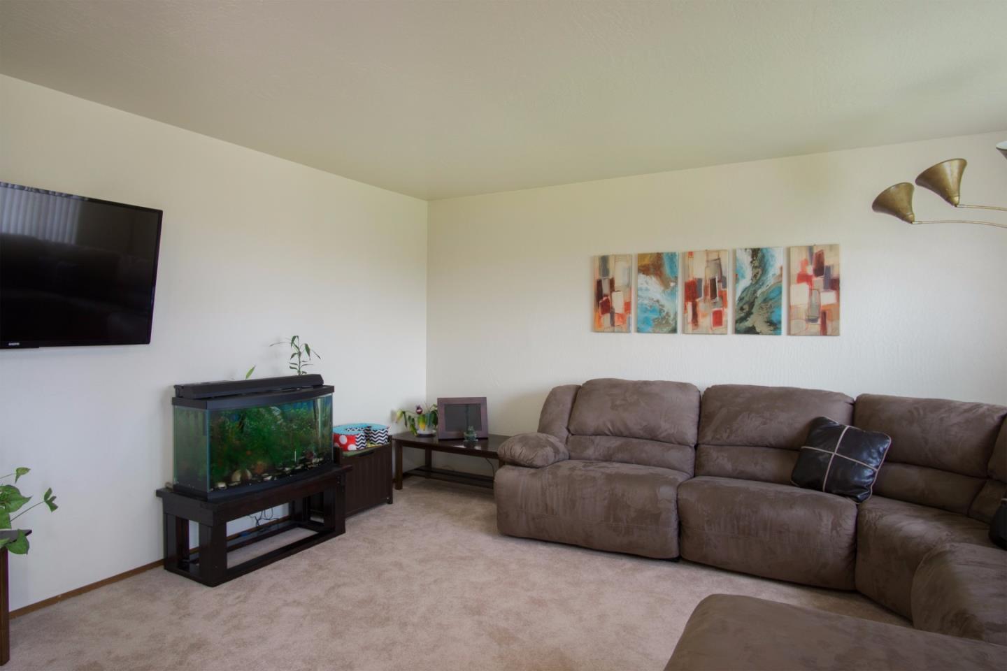 1626 Atherton Way Salinas, CA 93906 - Photo 13 of 23 a living room with furniture and a flat screen tv