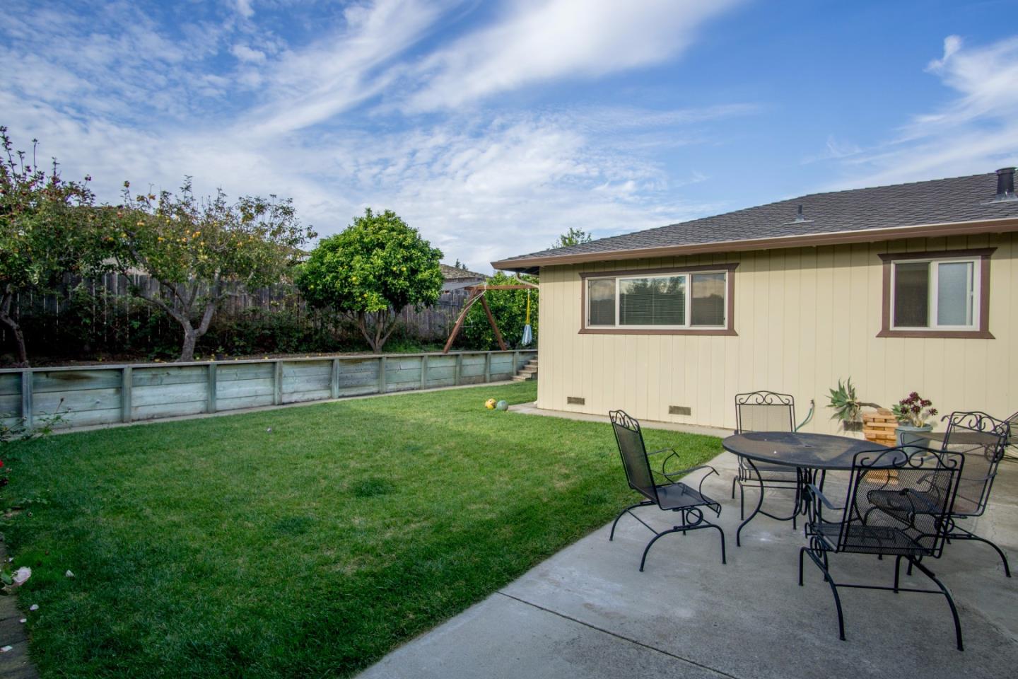 1626 Atherton Way Salinas, CA 93906 - Photo 22 of 23 a backyard of a house with table and chairs