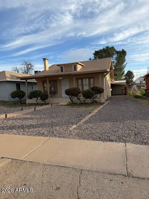 1129 11th Street Douglas, AZ 85607 - Photo 2 of 13 a view of a car park in front of a house