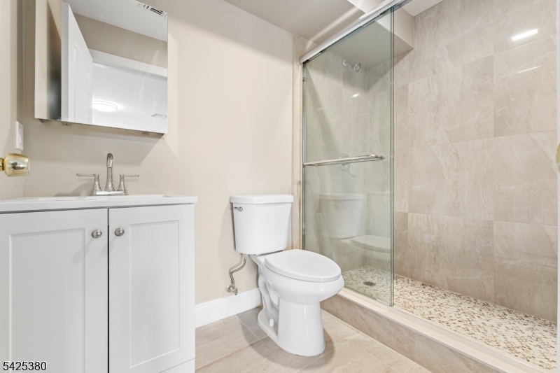658 Market Street Paterson, NJ 07513 - Photo 2 of 19 a bathroom with a sink toilet and shower