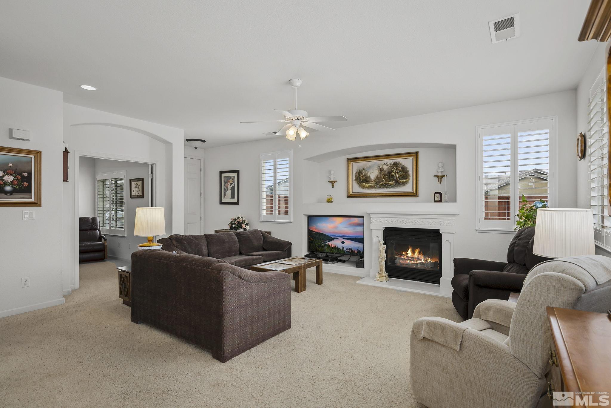 1735 Ornellaia Way Reno, NV 89521 - Photo 3 of 21 a living room with furniture and a fireplace