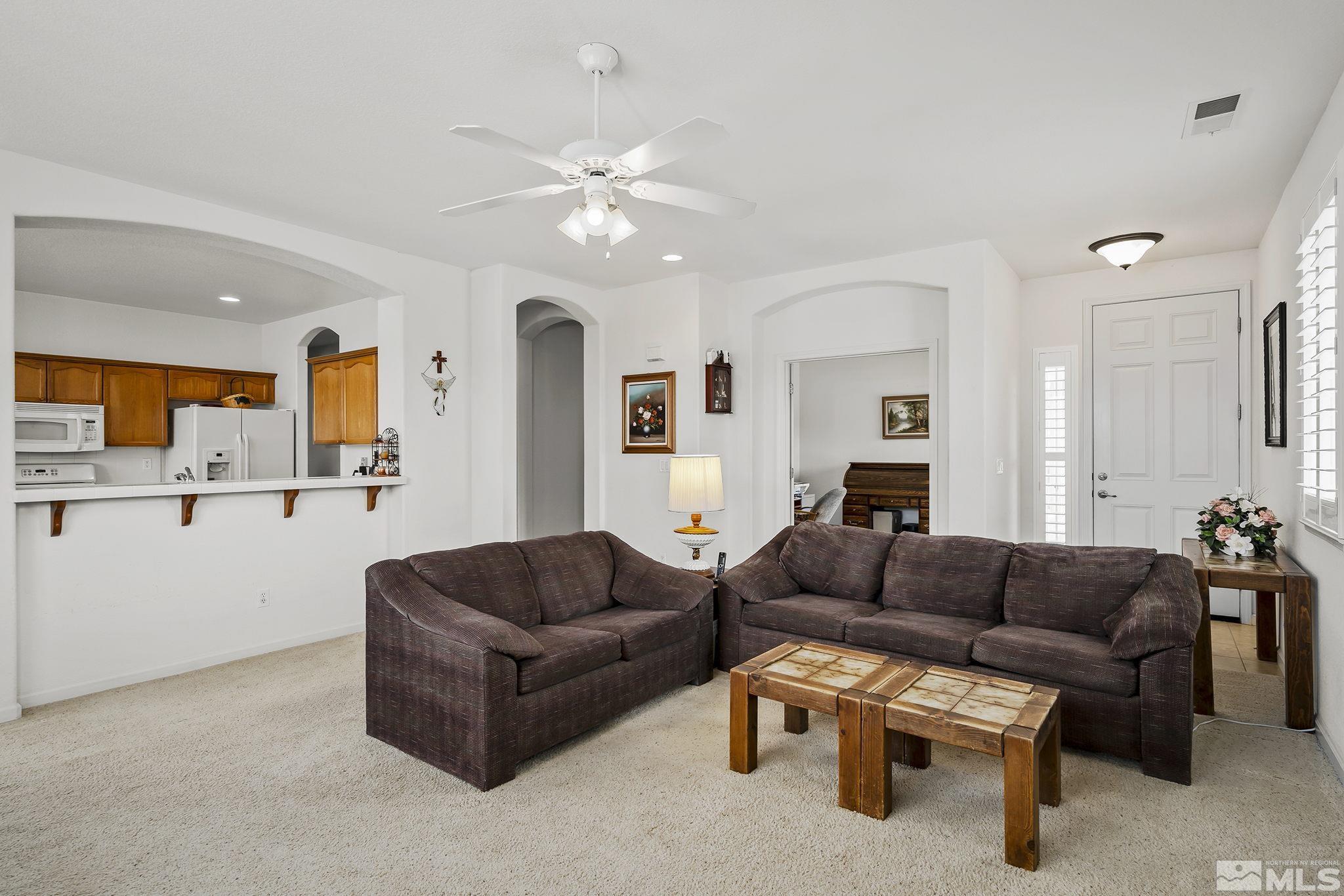 1735 Ornellaia Way Reno, NV 89521 - Photo 5 of 21 a living room with furniture and a view of kitchen