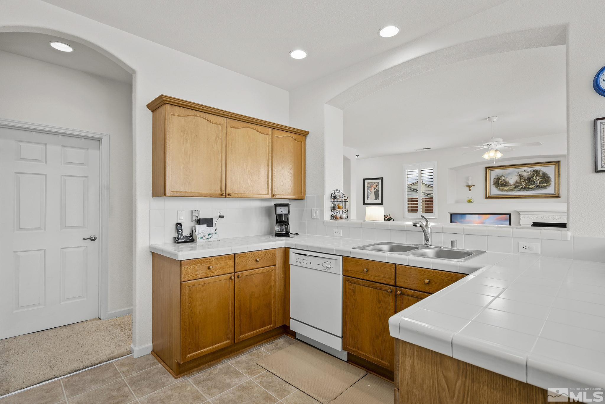 1735 Ornellaia Way Reno, NV 89521 - Photo 6 of 21 a kitchen with a sink stove and cabinets