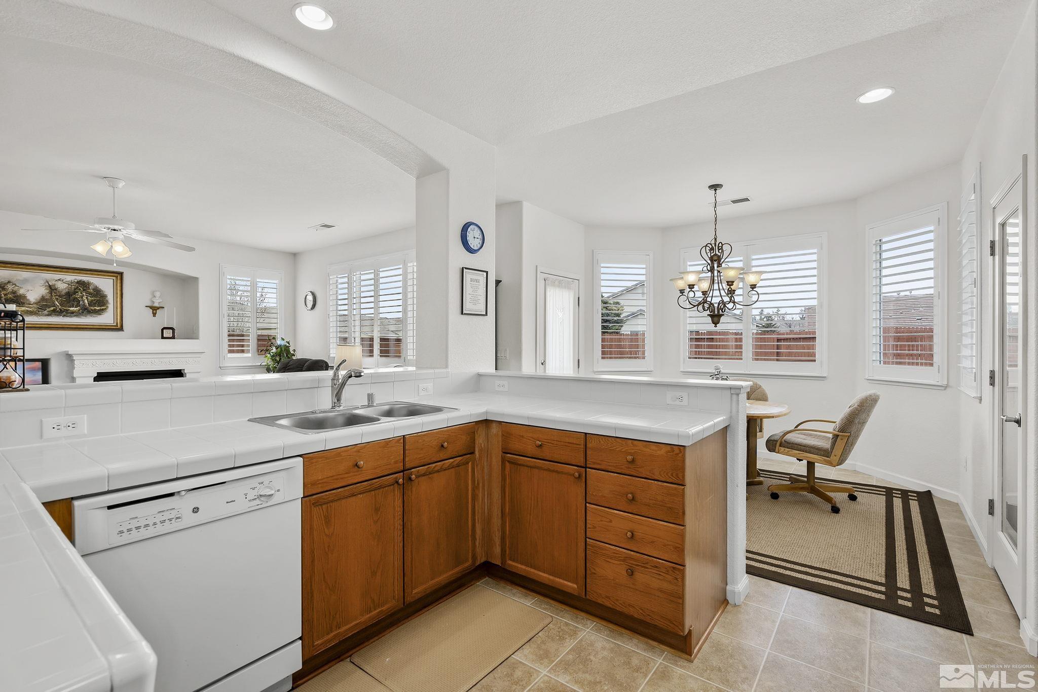 1735 Ornellaia Way Reno, NV 89521 - Photo 8 of 21 a kitchen with a sink stove and cabinets