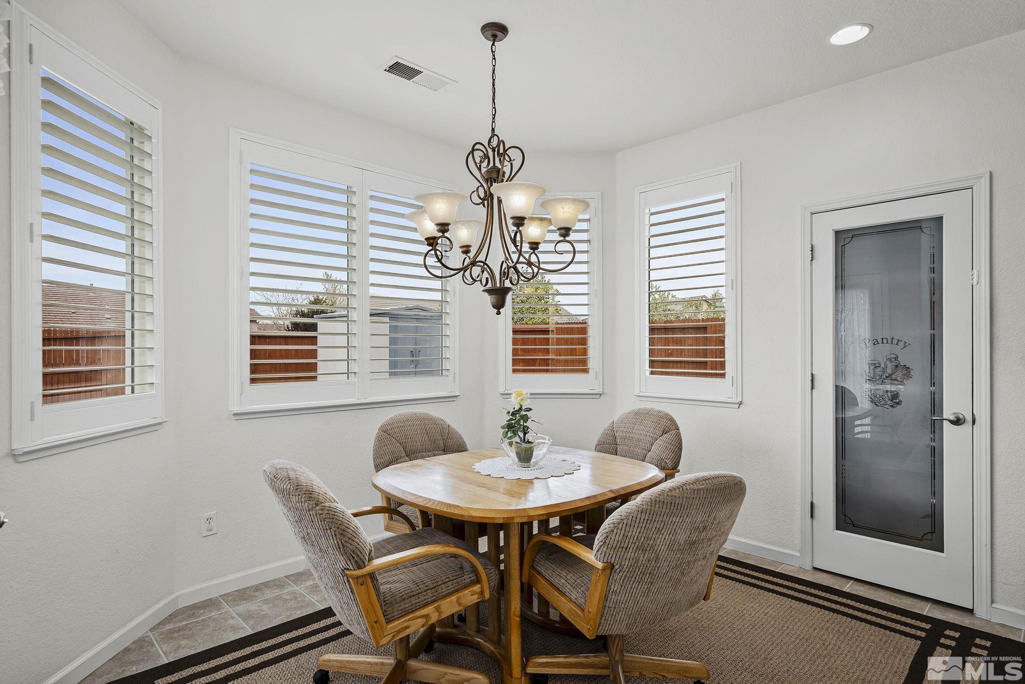 1735 Ornellaia Way Reno, NV 89521 - Photo 9 of 21 a dining room with furniture and window