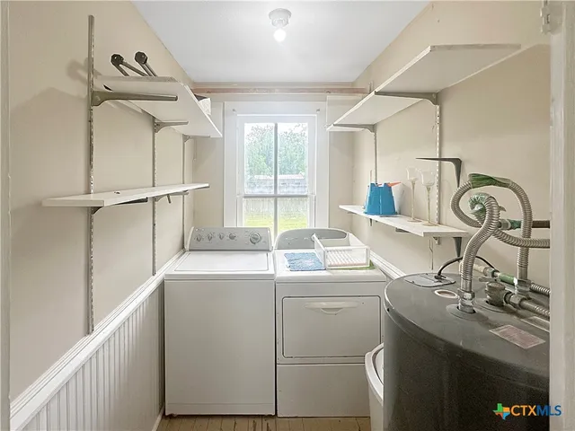 a kitchen with a sink and a stove top oven