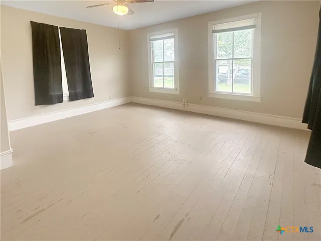 an empty room with windows