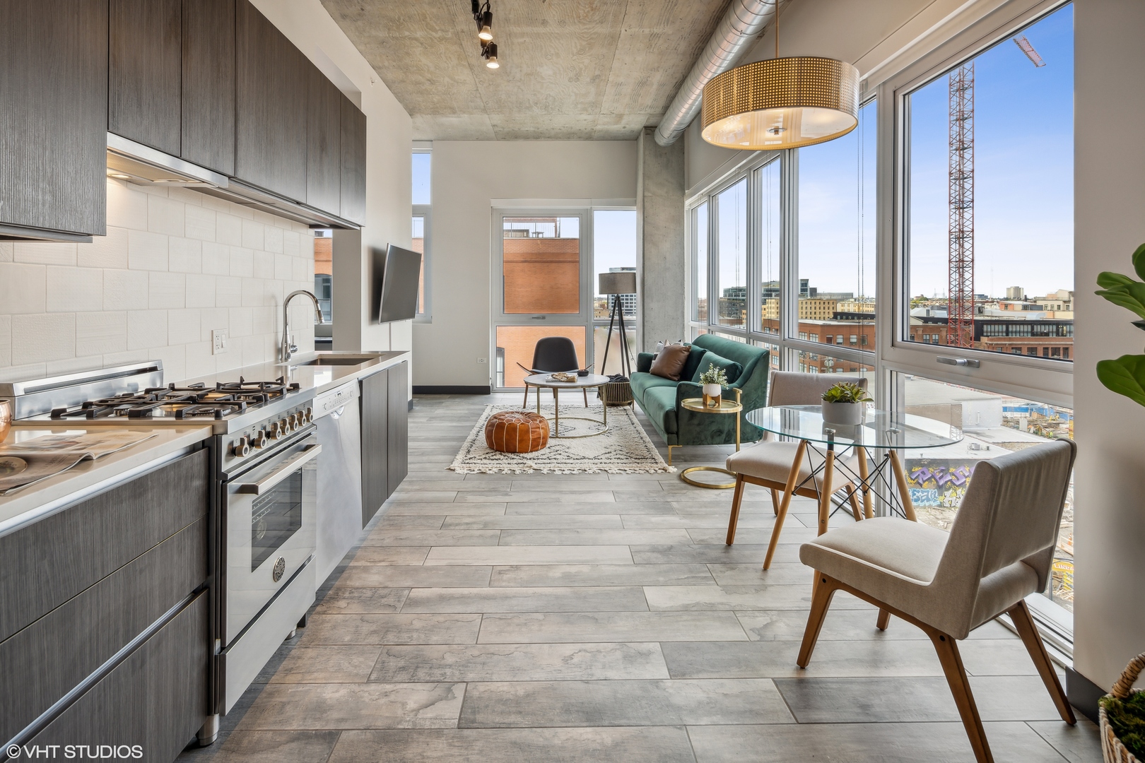 171 North Aberdeen Street, Unit 804 Chicago, IL 60607 - Photo 3 of 23 a kitchen with stainless steel appliances granite countertop a stove a sink and a refrigerator