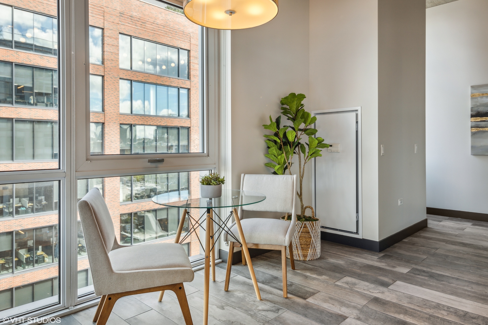 171 North Aberdeen Street, Unit 804 Chicago, IL 60607 - Photo 4 of 23 a view of a dining room with furniture window and wooden floor