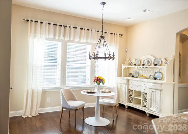 a dining room with furniture and window