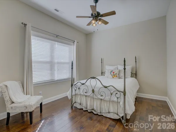 a bedroom with furniture and a window