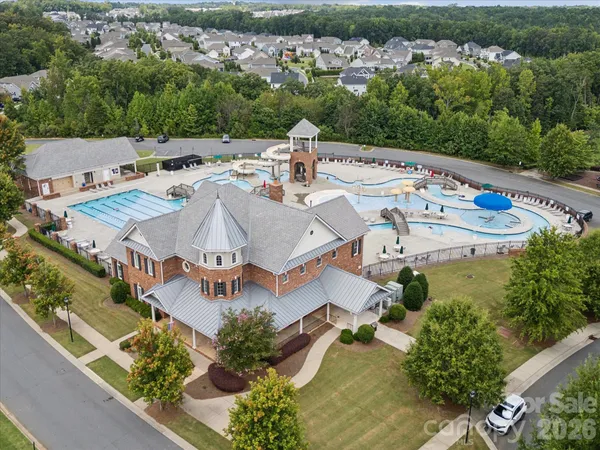 an aerial view of residential house with outdoor space and swimming pool