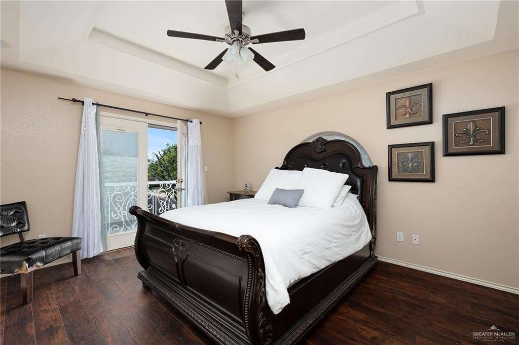 818 Hill Country Road Edinburg, TX 78539 - Photo 13 of 24 a large bed sitting in a bedroom next to a window
