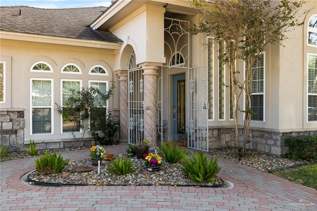 818 Hill Country Road Edinburg, TX 78539 - Photo 19 of 24 a front view of a house with a garden