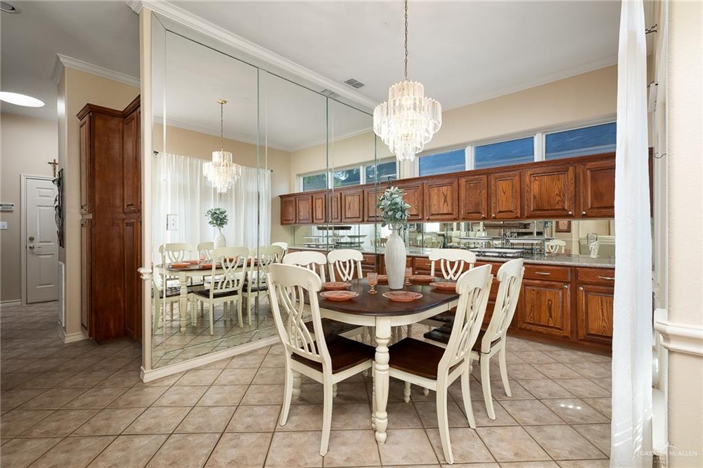 818 Hill Country Road Edinburg, TX 78539 - Photo 6 of 24 a view of a dining room with furniture window and wooden floor