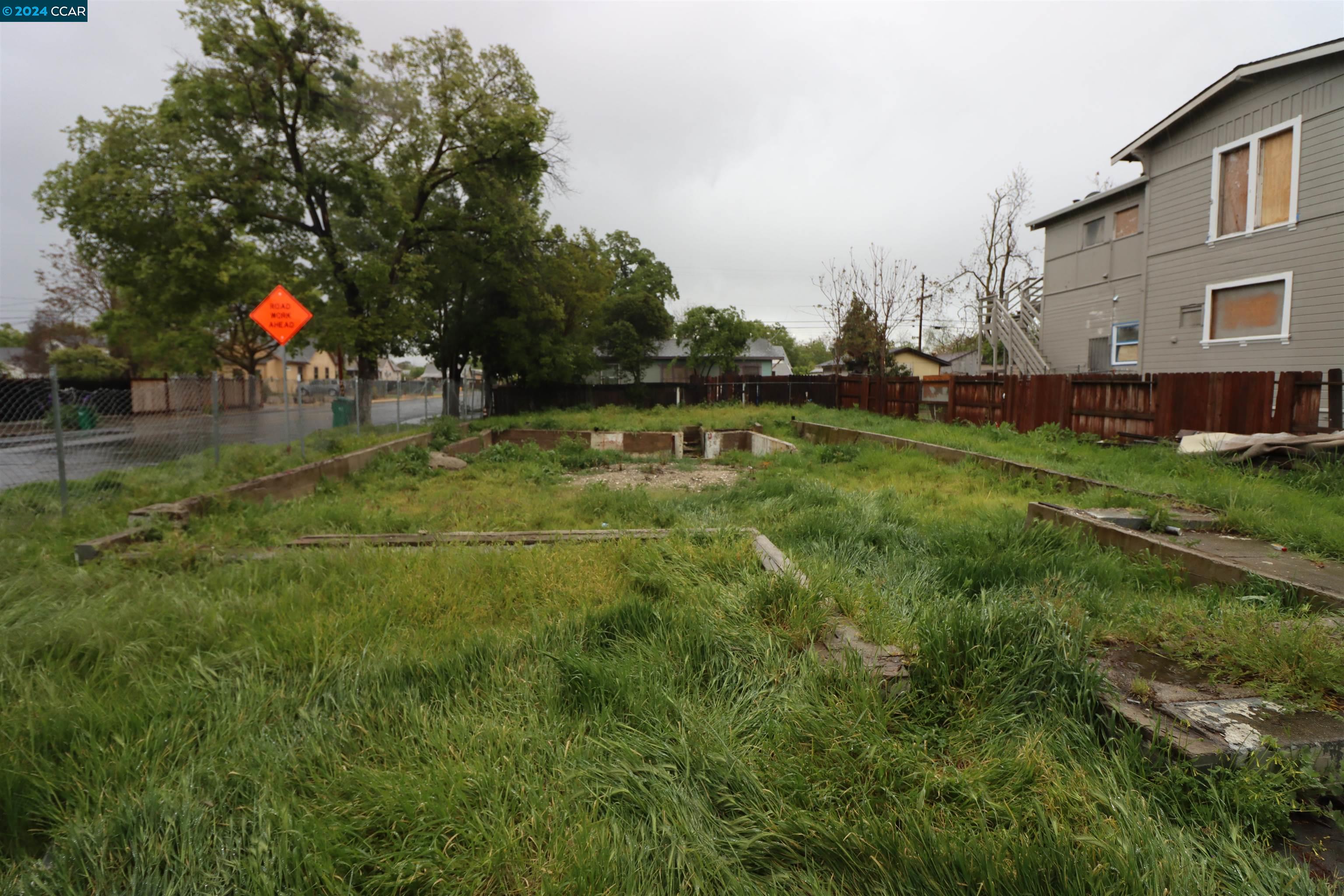 1602 South Sutter Street Stockton, CA 95206 - Photo 6 of 12 a view of yard with swimming pool and trees